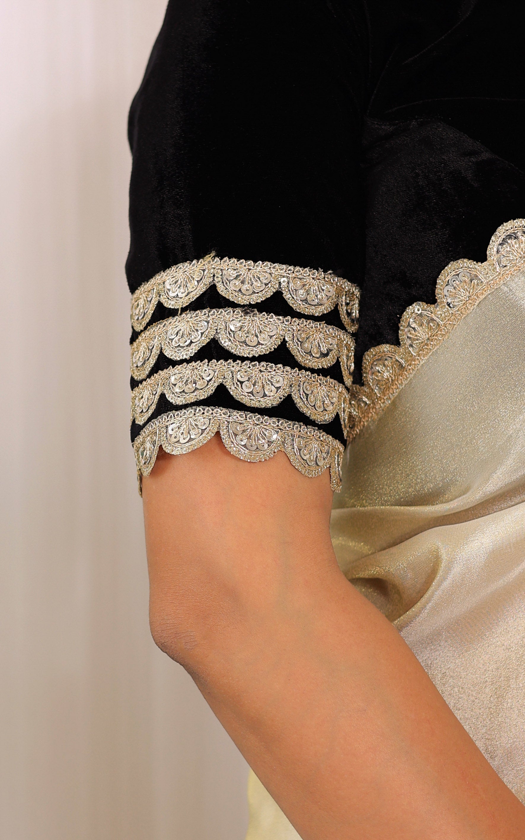 Roopal Golden Tissue Saree with Black Velvet Blouse