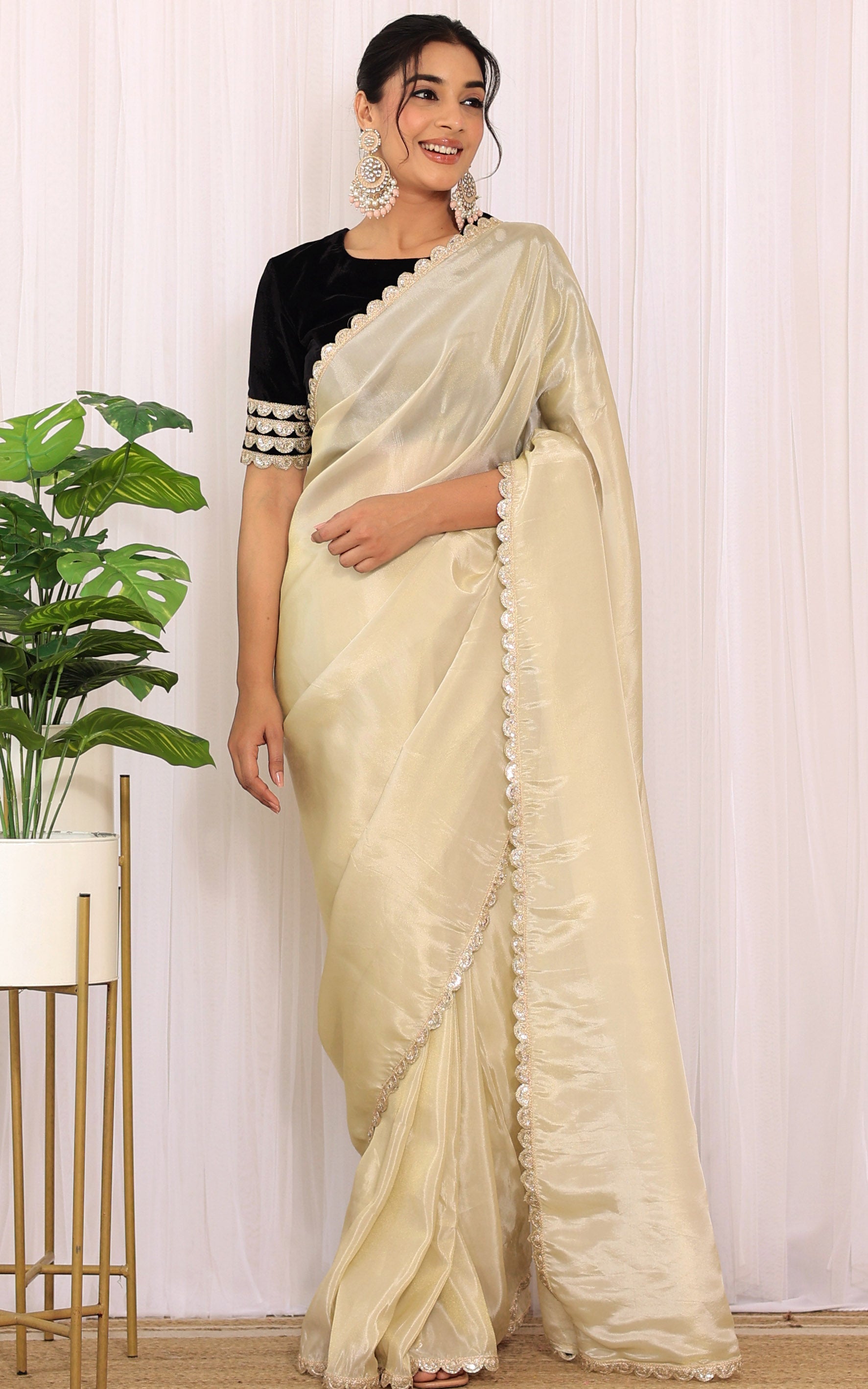 Golden Tissue Saree with Black Velvet Blouse